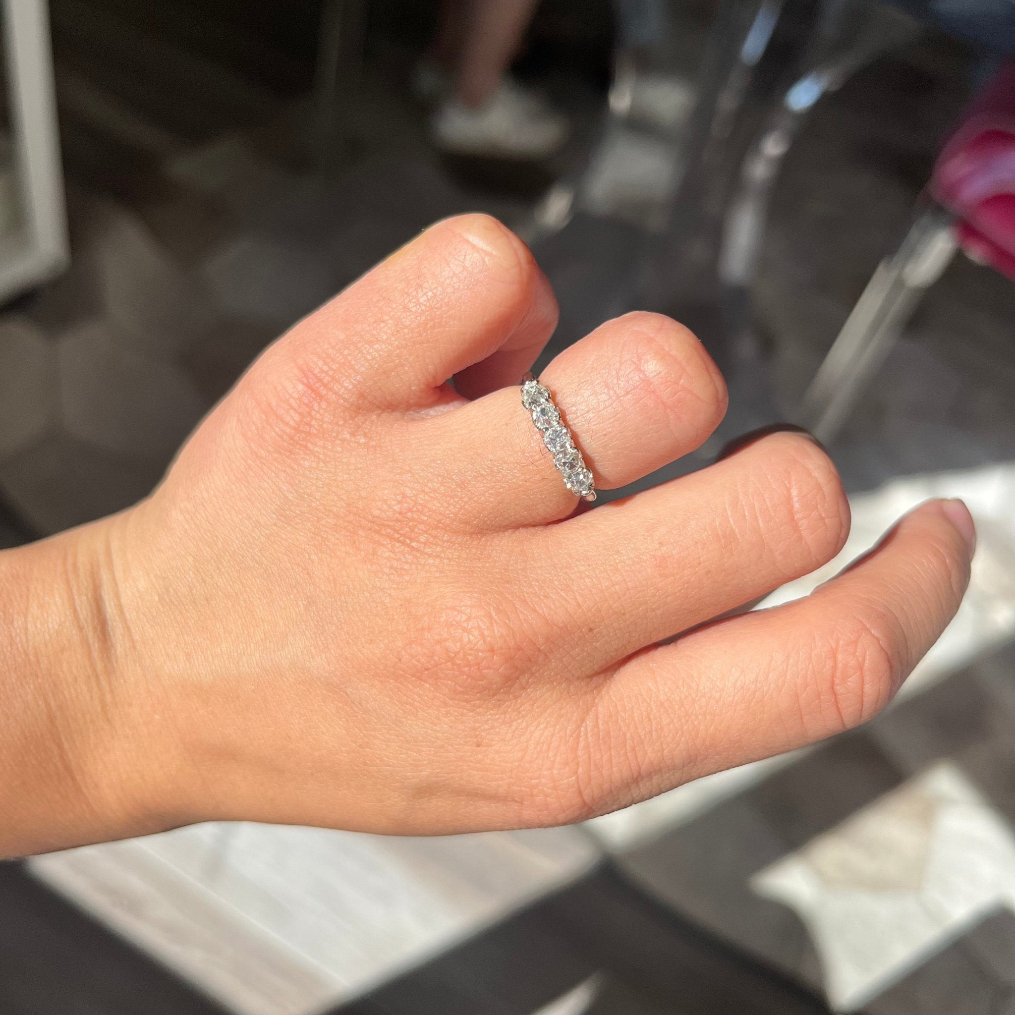 Elegant .94ctw Petite Old Mine Cut Diamond 5-Stone Band, romantic design with Old Mine Cut Diamonds, Earth-mined diamonds in platinum shown on ring finger