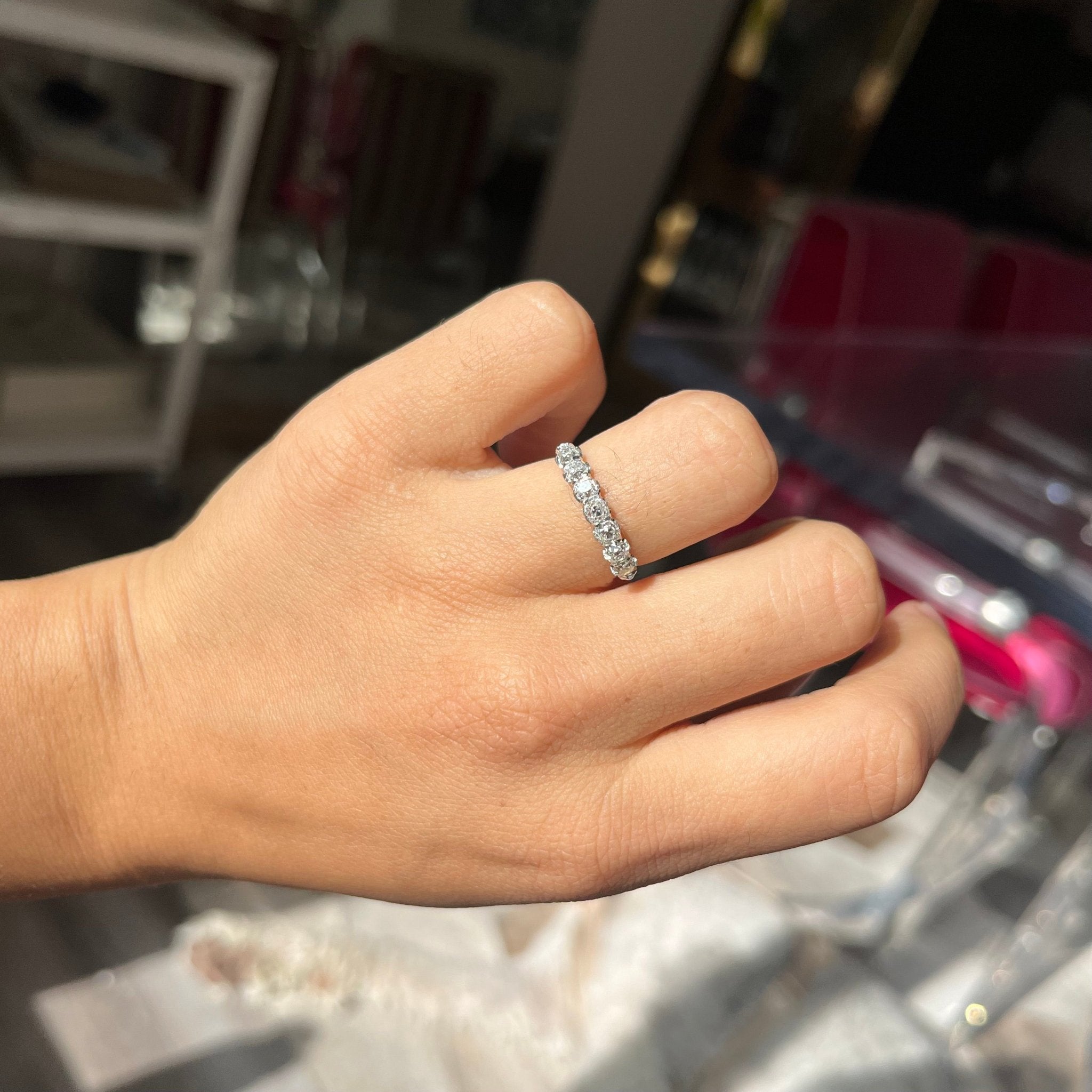 Elegant .94ctw Petite Old Mine Cut Diamond Half-Hoop Band, romantic design with Old Mine Cut Diamonds, Earth-mined diamonds in platinum shown on ring finger
