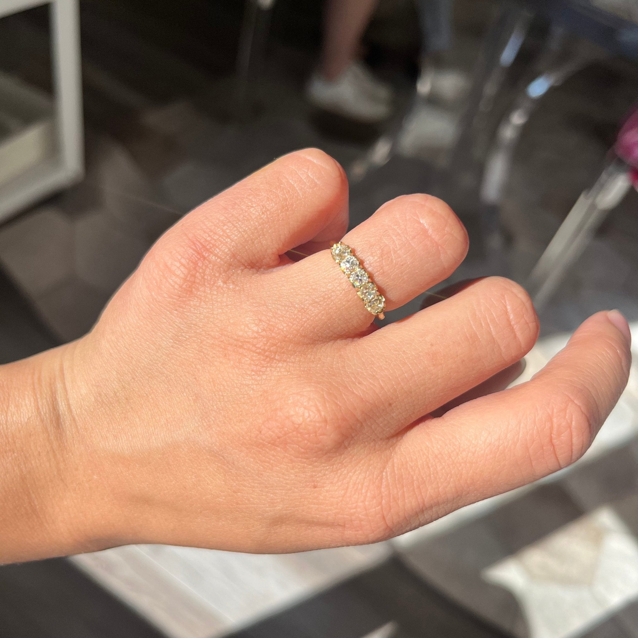 Elegant .95ctw Petite Old Mine Cut Diamond 5-Stone Band, romantic design with Old Mine Cut Diamonds, Earth-mined diamonds in yellow gold shown on ring finger