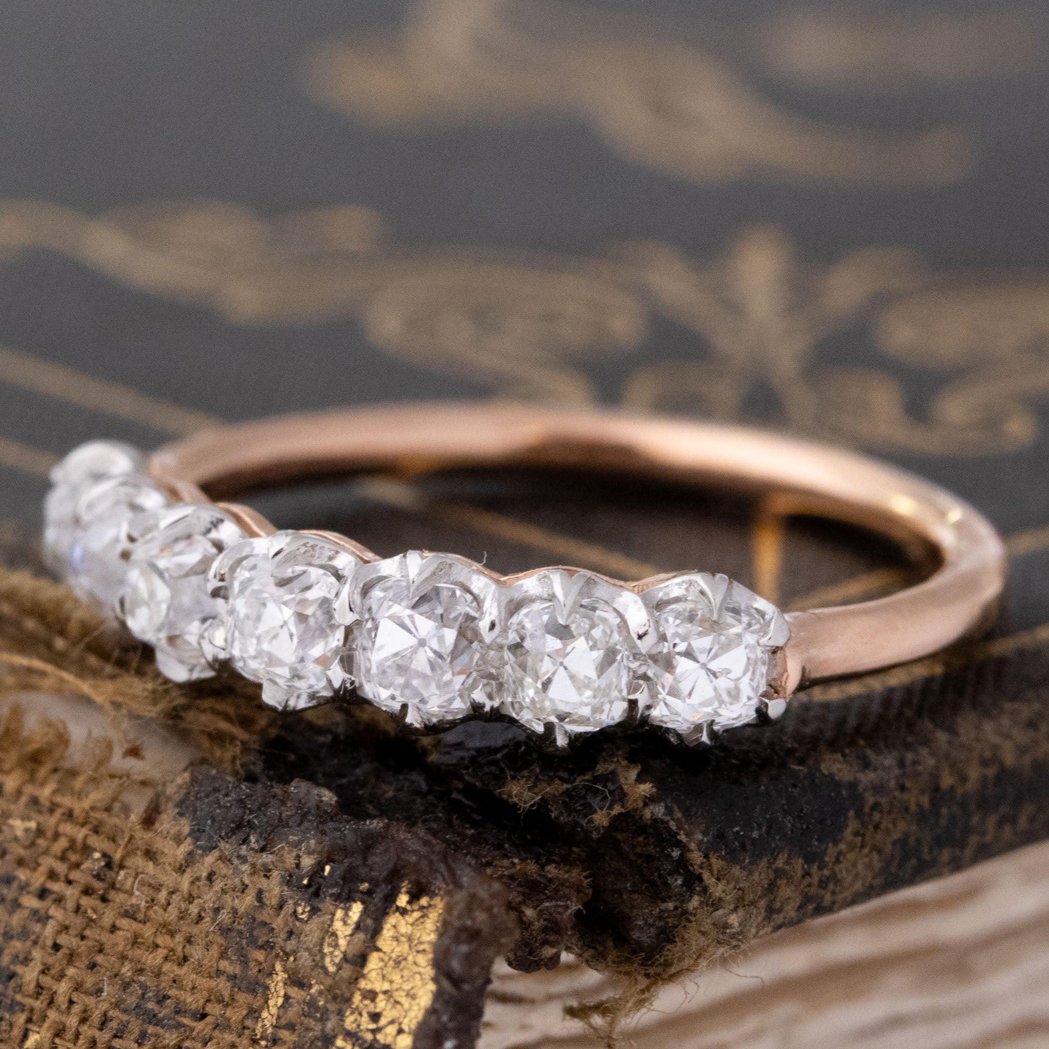 Antique lovers’ .96ctw Old Mine Cut Diamond 7-Stone Band in platinum and rose gold, featuring rare Earth-mined Old Mine Cut Diamonds