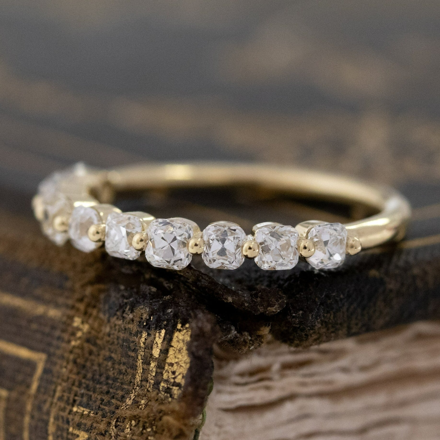 Antique lovers’ .97ctw Old Mine Cut Diamond Shared Prong Half-Hoop Band in yellow gold, featuring rare Earth-mined Old Mine Cut Diamonds