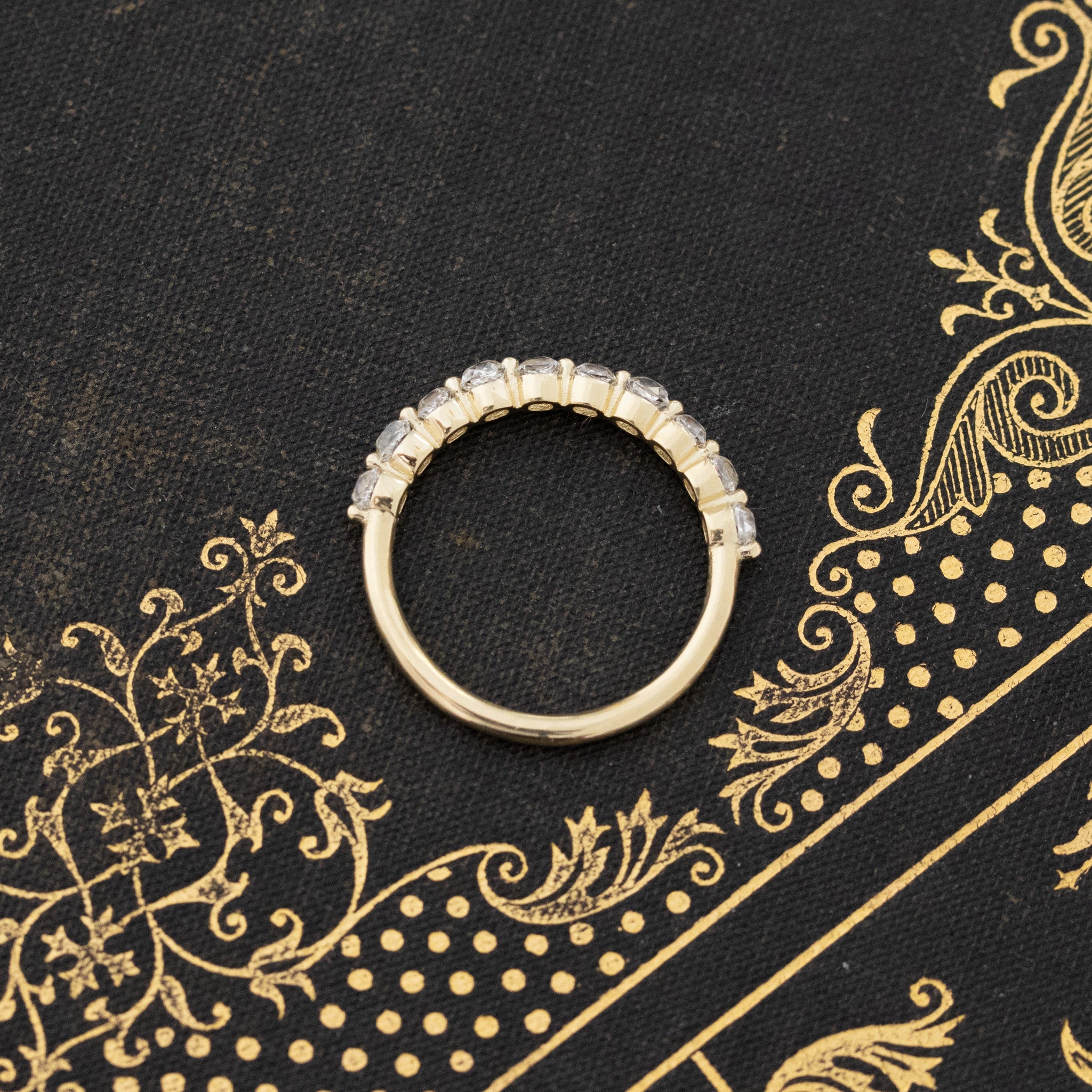 Side view of .97ctw Old Mine Cut Diamond Shared Prong Half-Hoop Band, vintage-inspired band with Old Mine Cut Diamonds, crafted in yellow gold