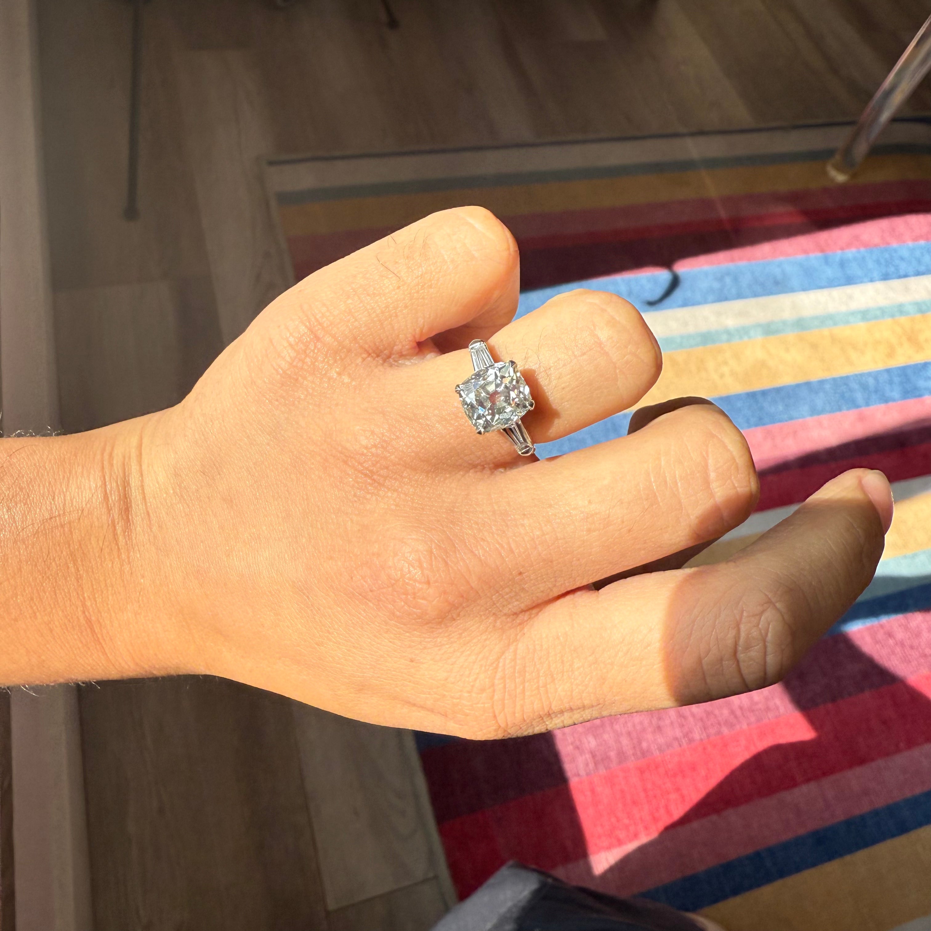 Warm tone Old Mine cut diamond ring, 3.53 carats shown on hand