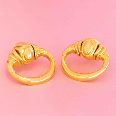 Vintage 1971 Cartier door knocker clip-on earrings in 18k yellow gold by Aldo Cipullo, featuring bold sculptural design