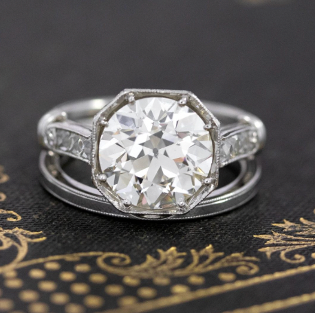 3.04ct Old European cut diamond in an octagonal bezel ring paired with a classic platinum wedding band featuring milgrain detail.