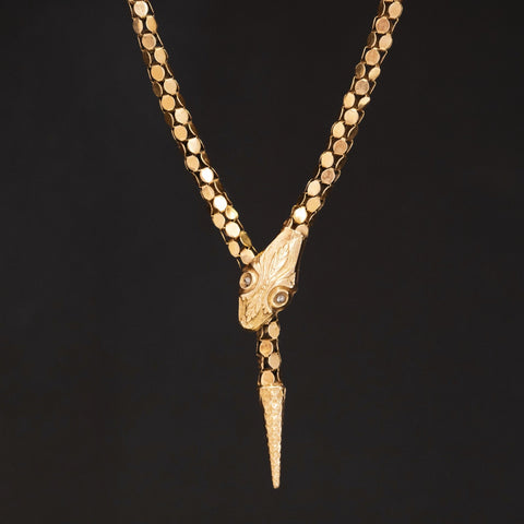 Close-up of antique serpent necklace in yellow gold