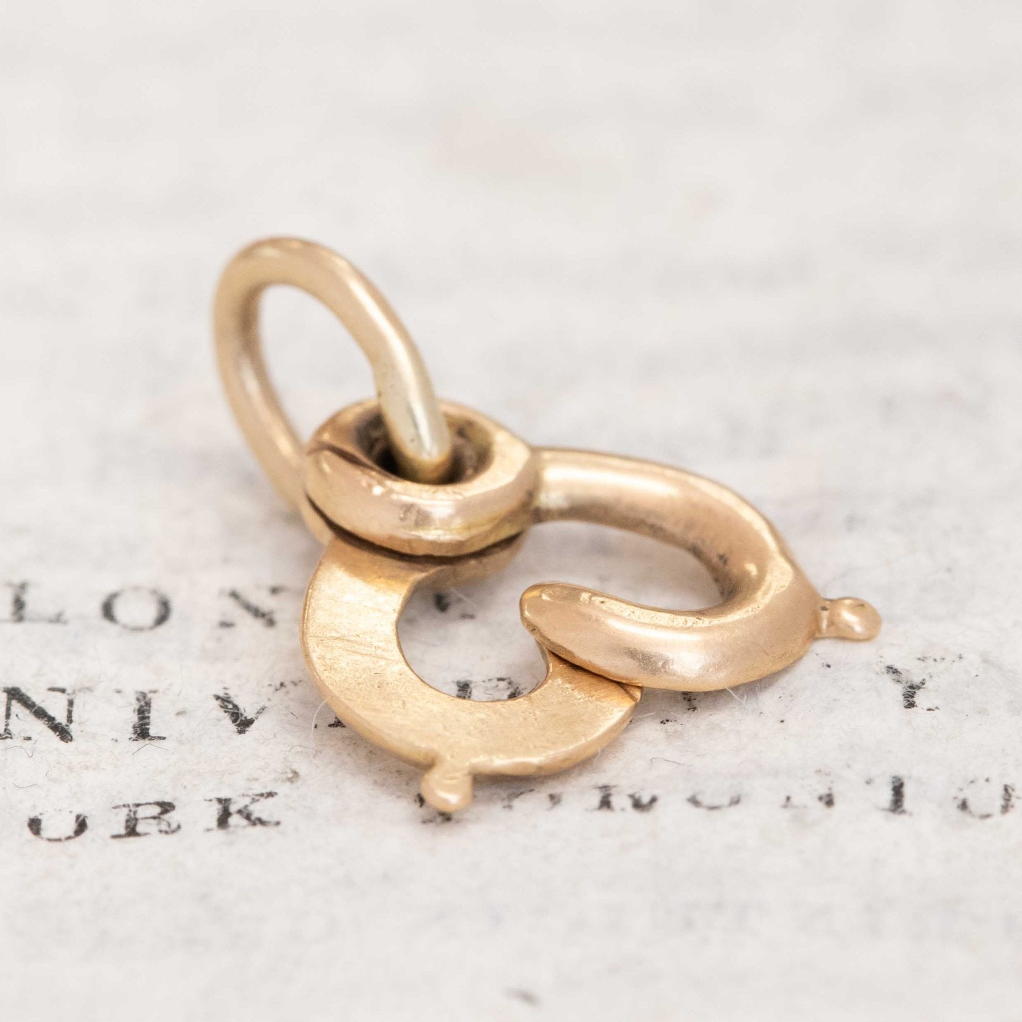 18k gold antique clasp used for attaching chains and lockets, known as sister clasp.