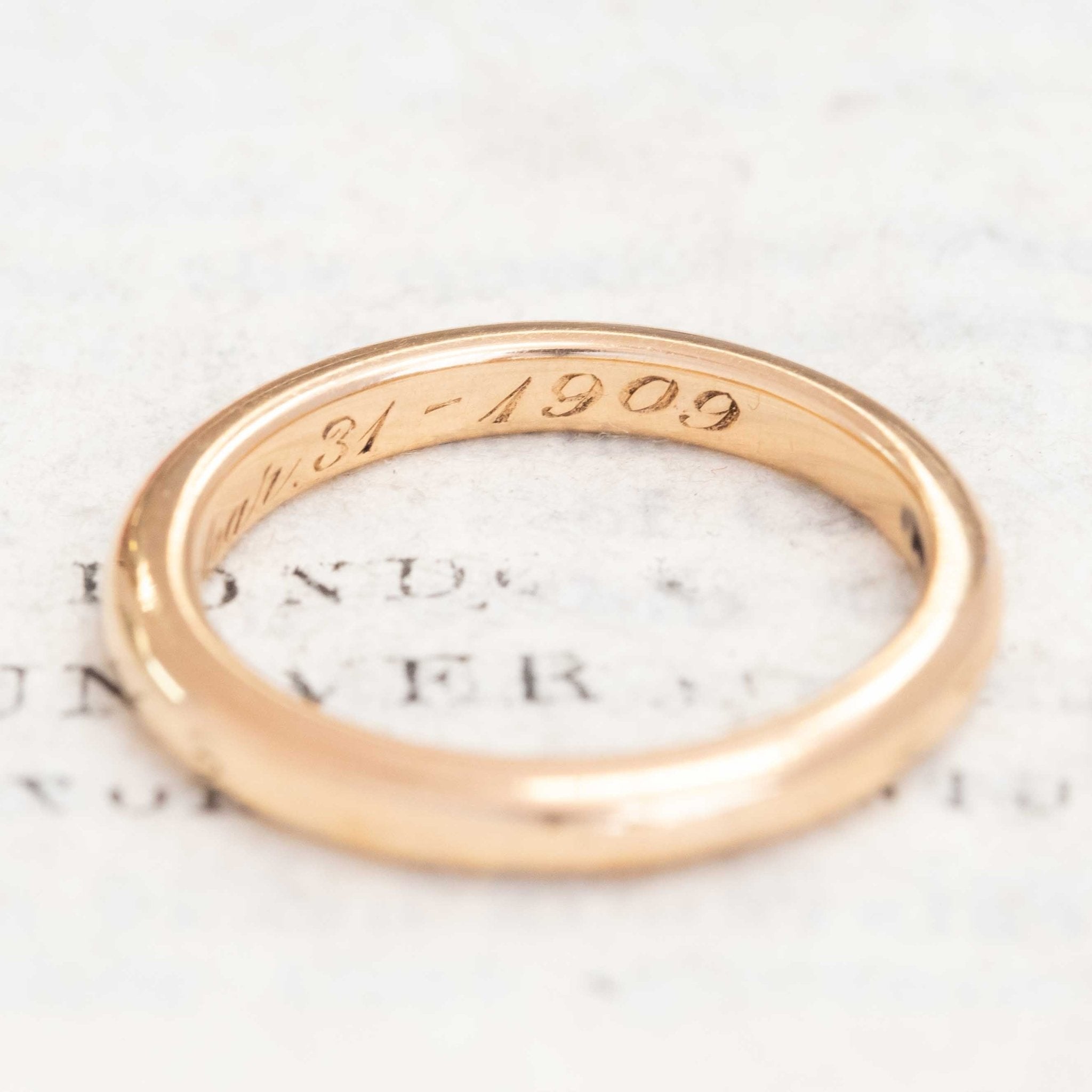 Unisex antique 18kt gold wedding band with warm glow.