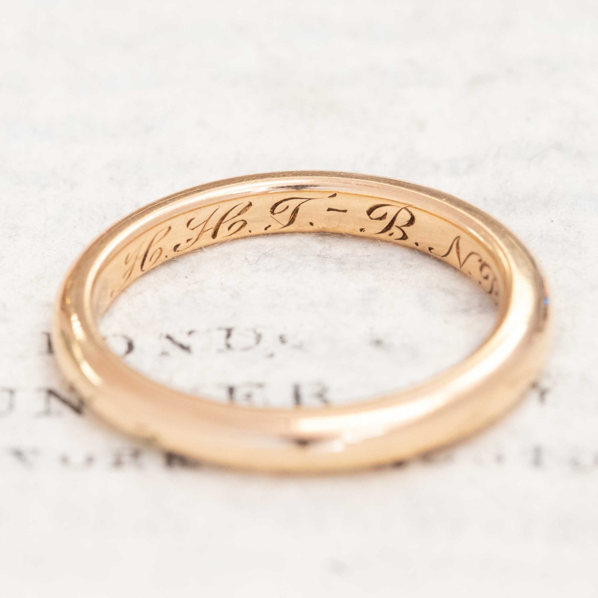 Classic plain 18kt gold band with antique finish.