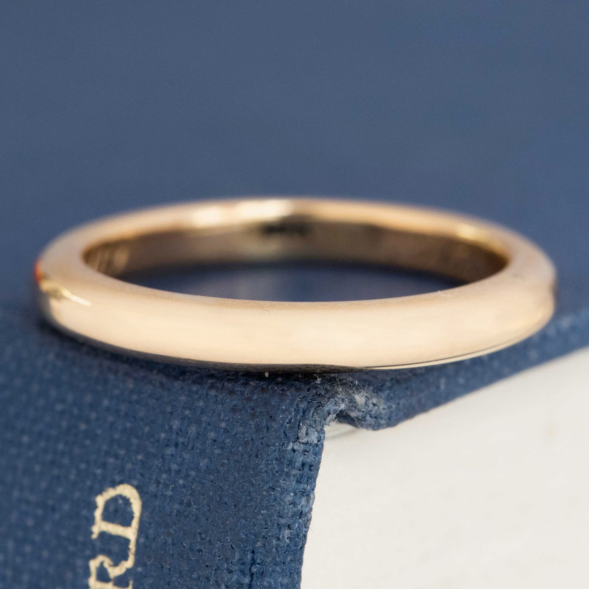 Warm yellow antique 18kt gold band with smooth finish.