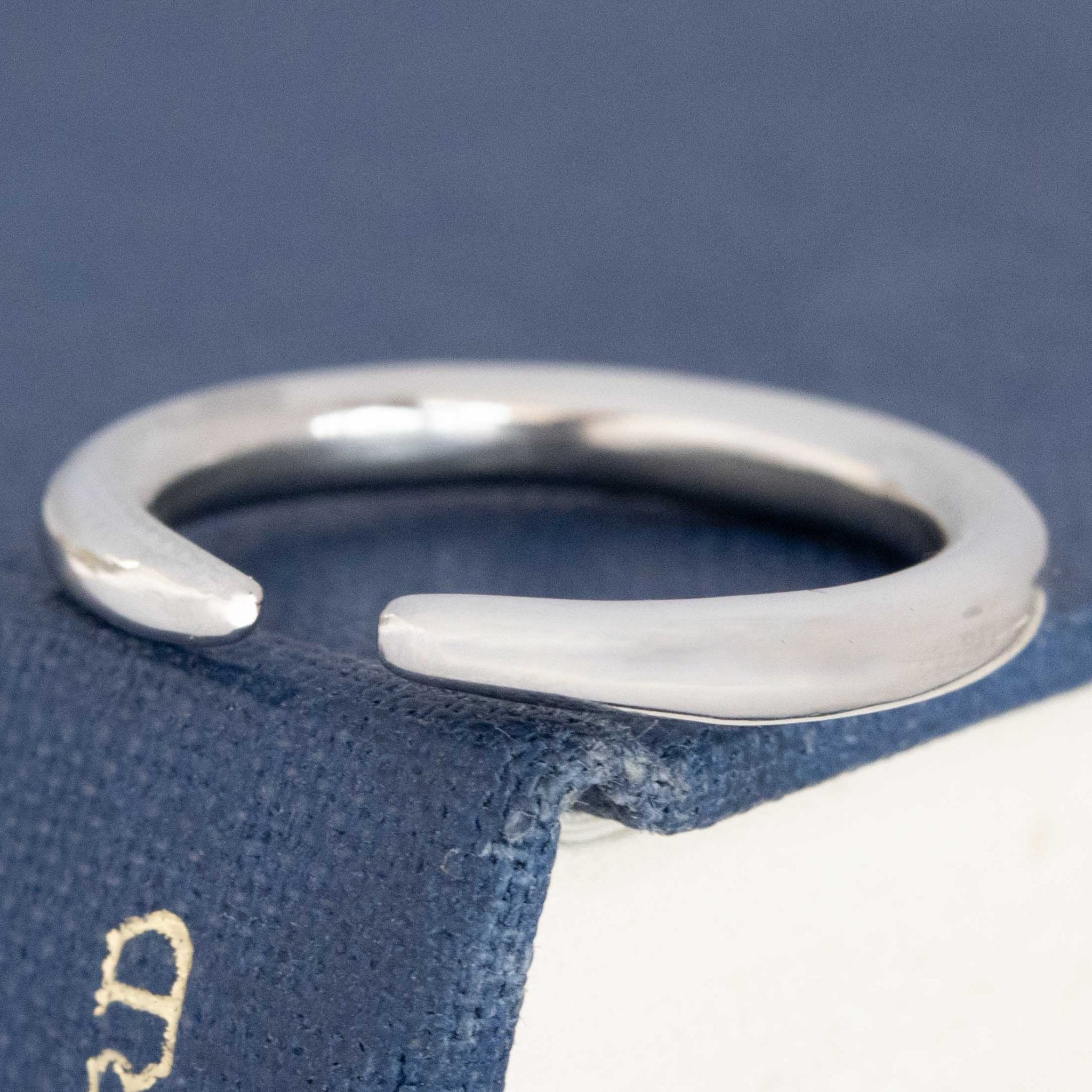 Close-up of "Arc" Wedding Band in Platinum, vintage-inspired band.