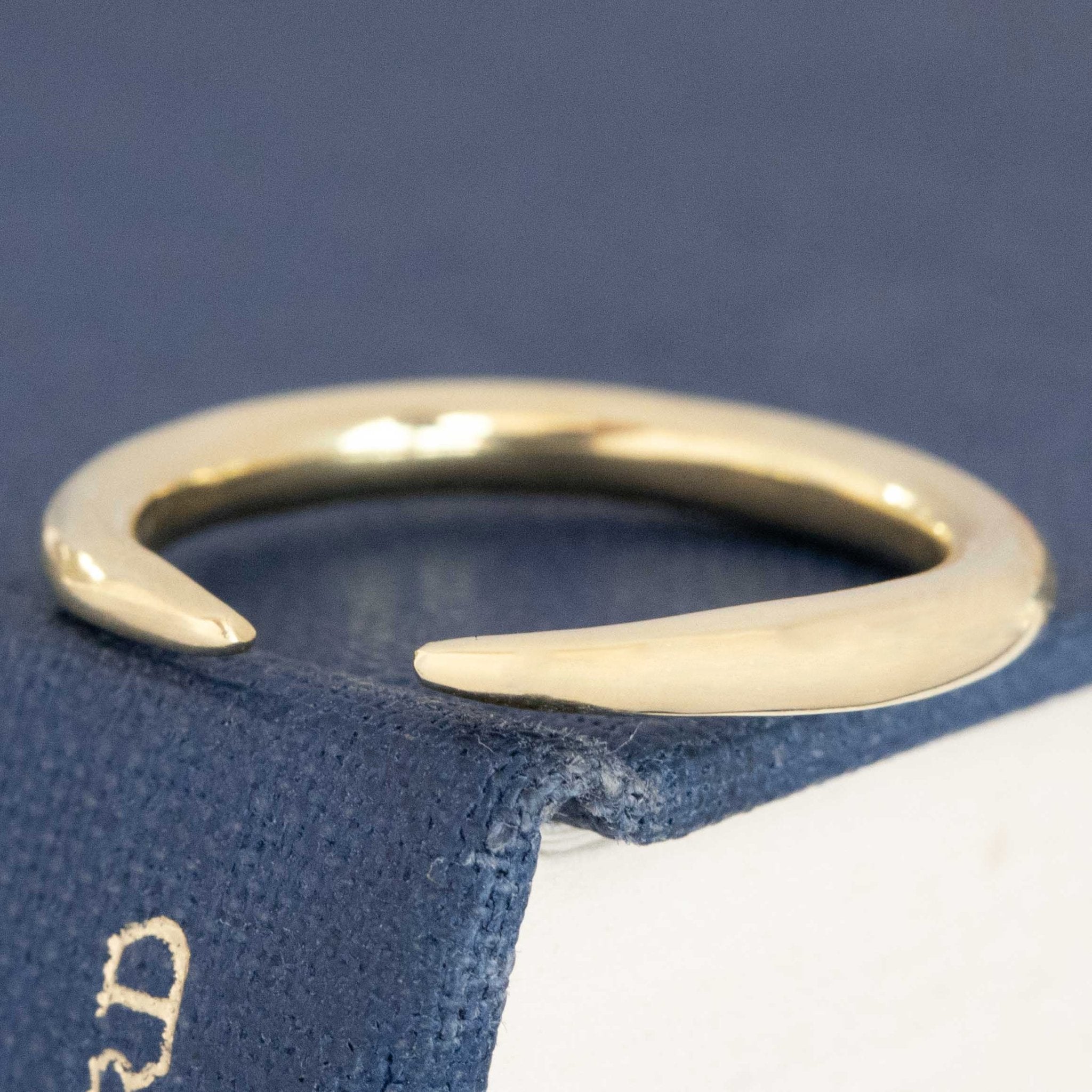 Close-up of "Arc" Wedding Band in Yellow Gold. Vintage-inspired band crafted in yellow gold.