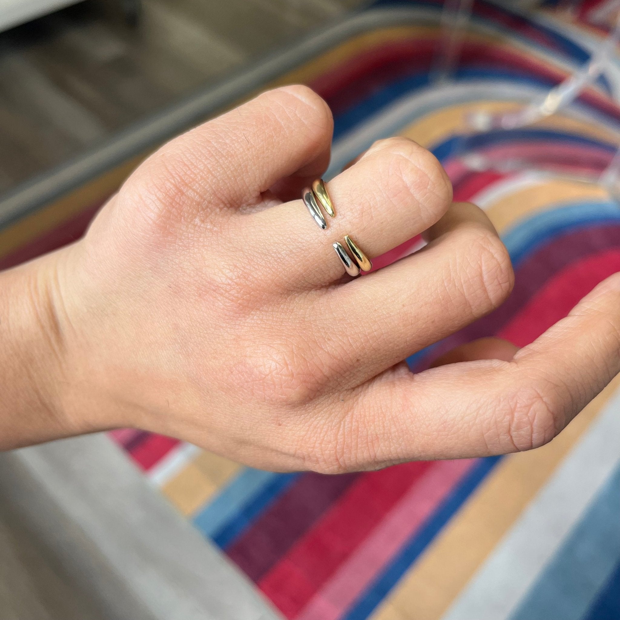 "Arc" Wedding Band in Yellow Gold stacked atop another "Arc" Band in Platinum, classic heirloom band.