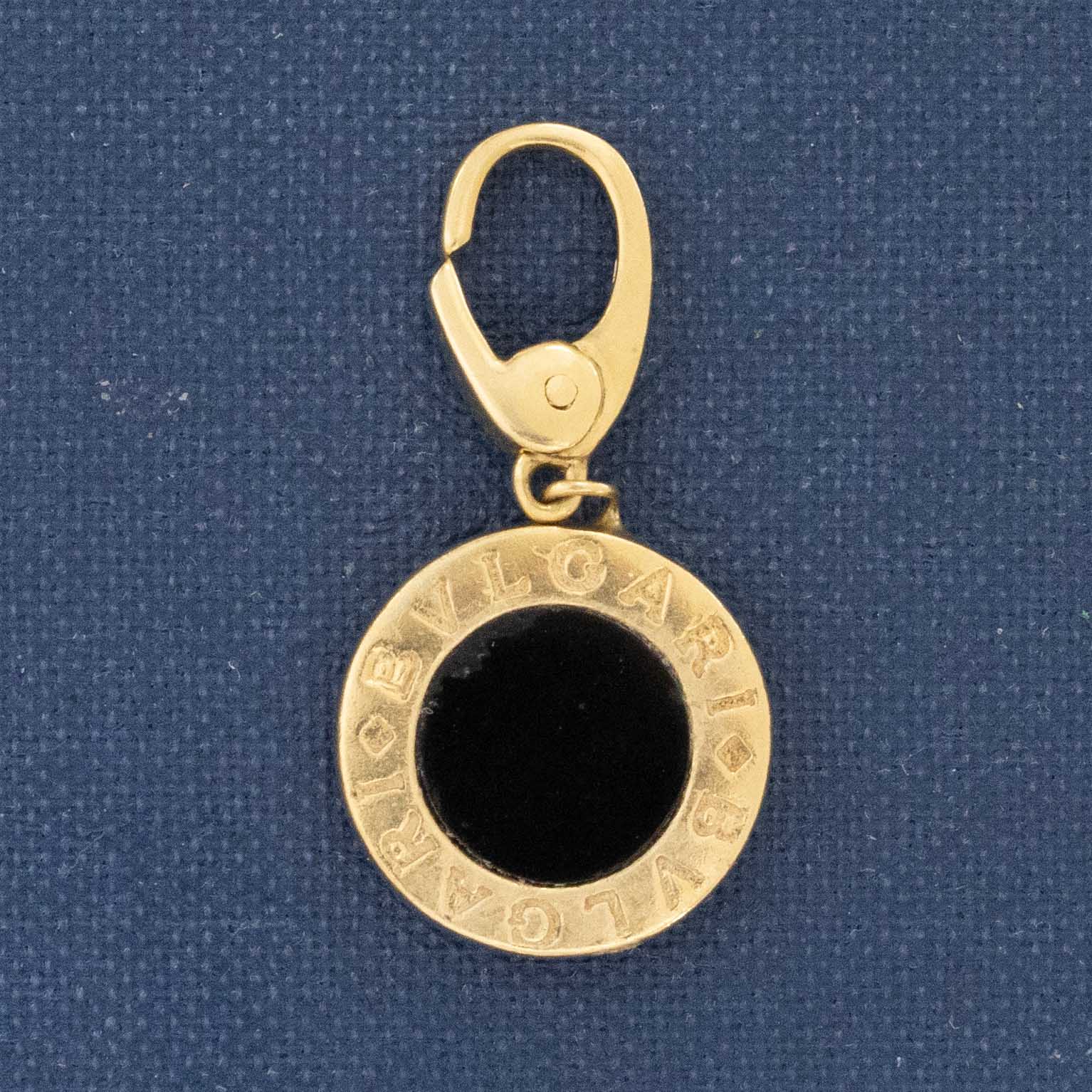 Vintage Bvlgari zodiac-inspired pendant in solid 18-karat yellow gold featuring pavé white diamonds and signature BVLGARI engraving, authentic Italian luxury designer jewelry from Jewels by Grace