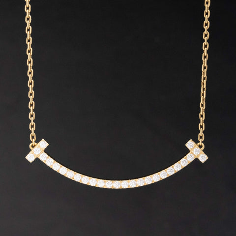 Diamond T Smile Pendant by Tiffany & Co.