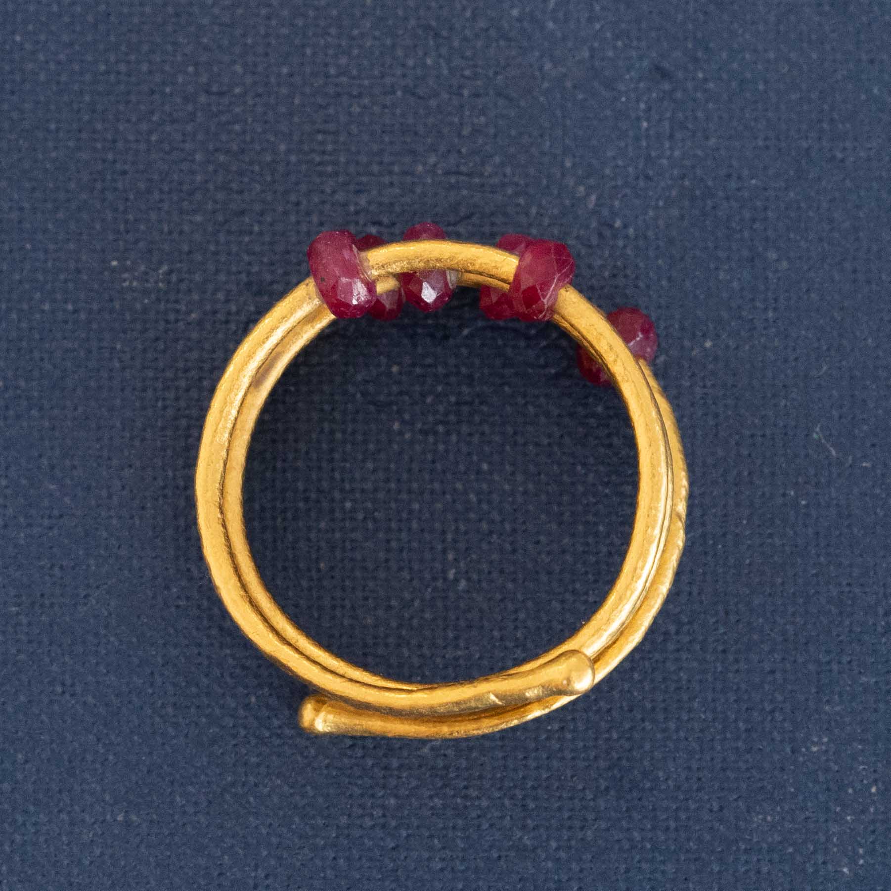 Pure gold and ruby gemstone coil ring handcrafted by Gurhan – timeless fine jewelry.