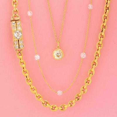 JbyG necklaces featuring vintage-inspired gold chains, old mine cut diamond pendant, and station necklace
