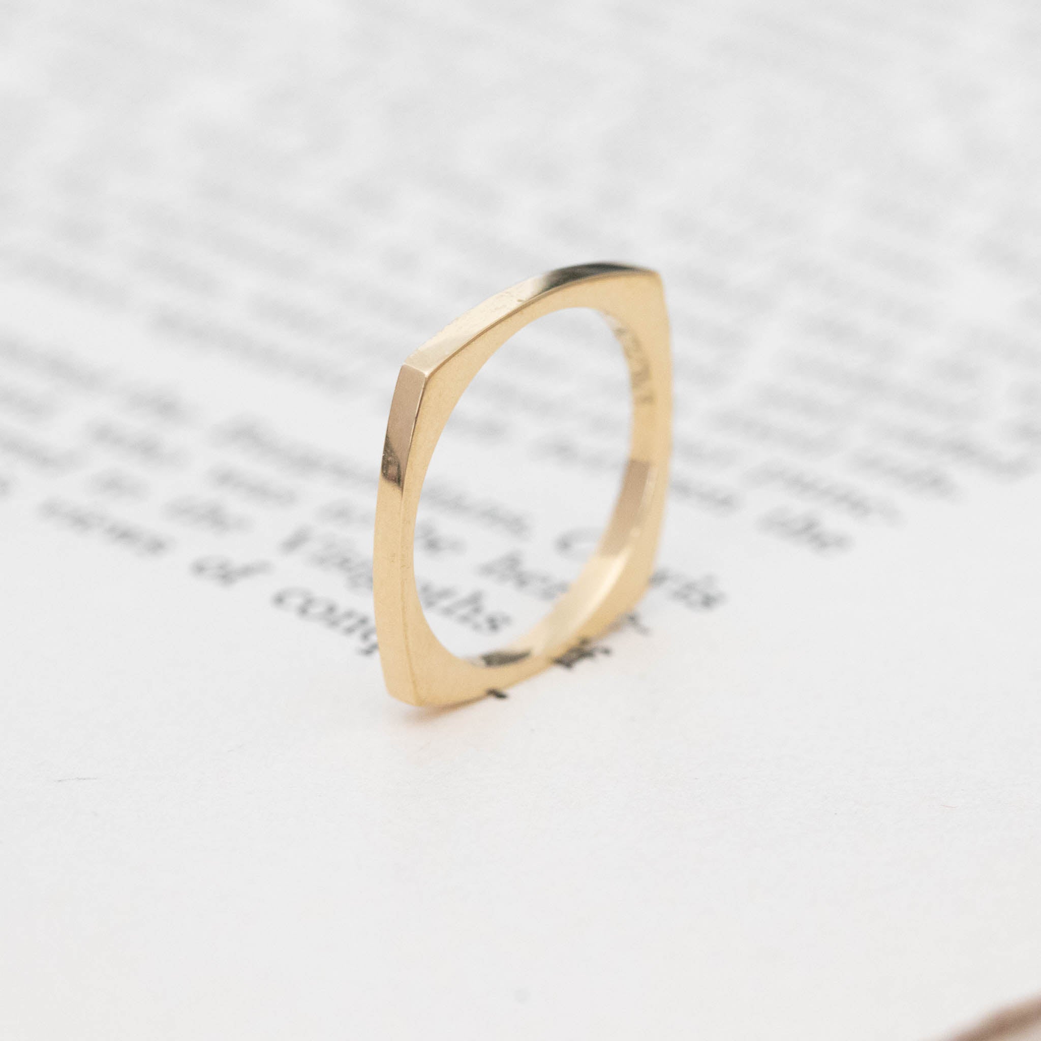 Jewels by Grace original design, square shank band in 20kt yellow gold.