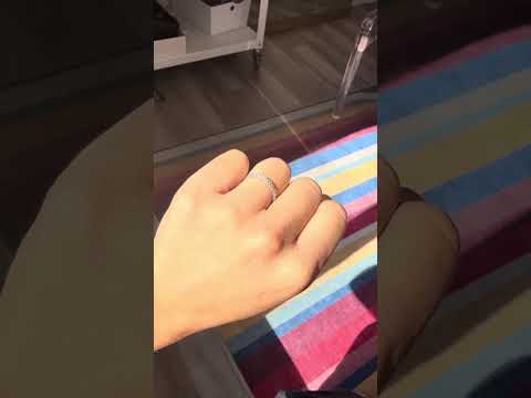 Video of round brilliant diamonds around full eternity band Tiffany shown on hand