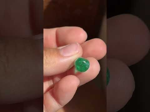 An antique Colombian emerald bead pendant with a beautiful, rich, and desirable color. Strung on an antique component with diamonds.