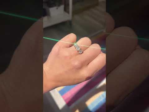A video showing a handshot of an antique 3-stone ring set with chunky old mine cut diamonds in a rosy yellow gold. Perfect vintage engagement ring choice