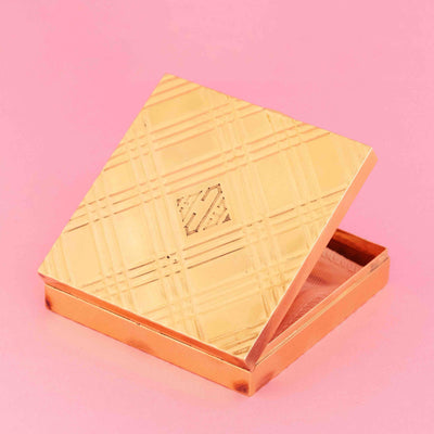 Antique Tiffany & Co. gold compact box in 14kt yellow gold with original case on pink background