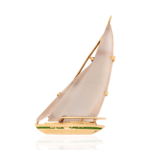 Vintage 14K gold sailboat brooch with carved quartz sails and green enamel