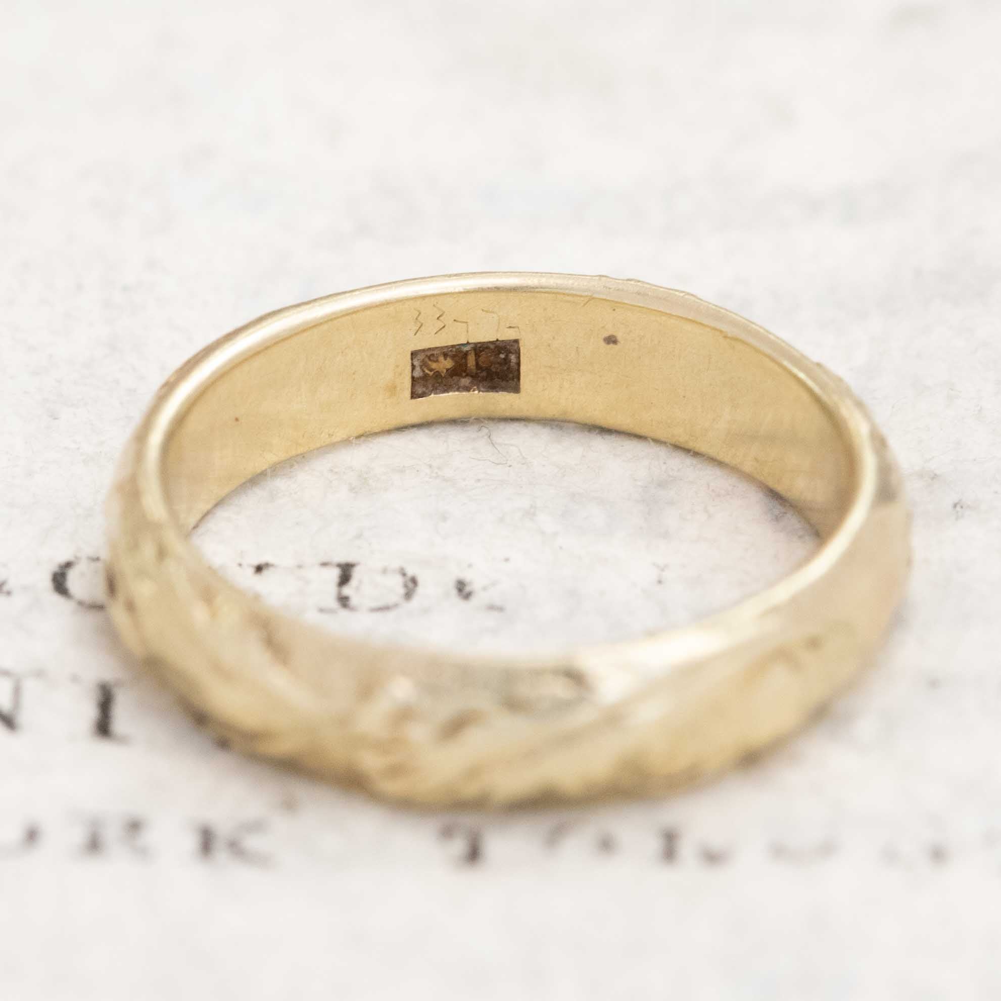 Classic 14kt antique gold etched wedding band, timeless design.