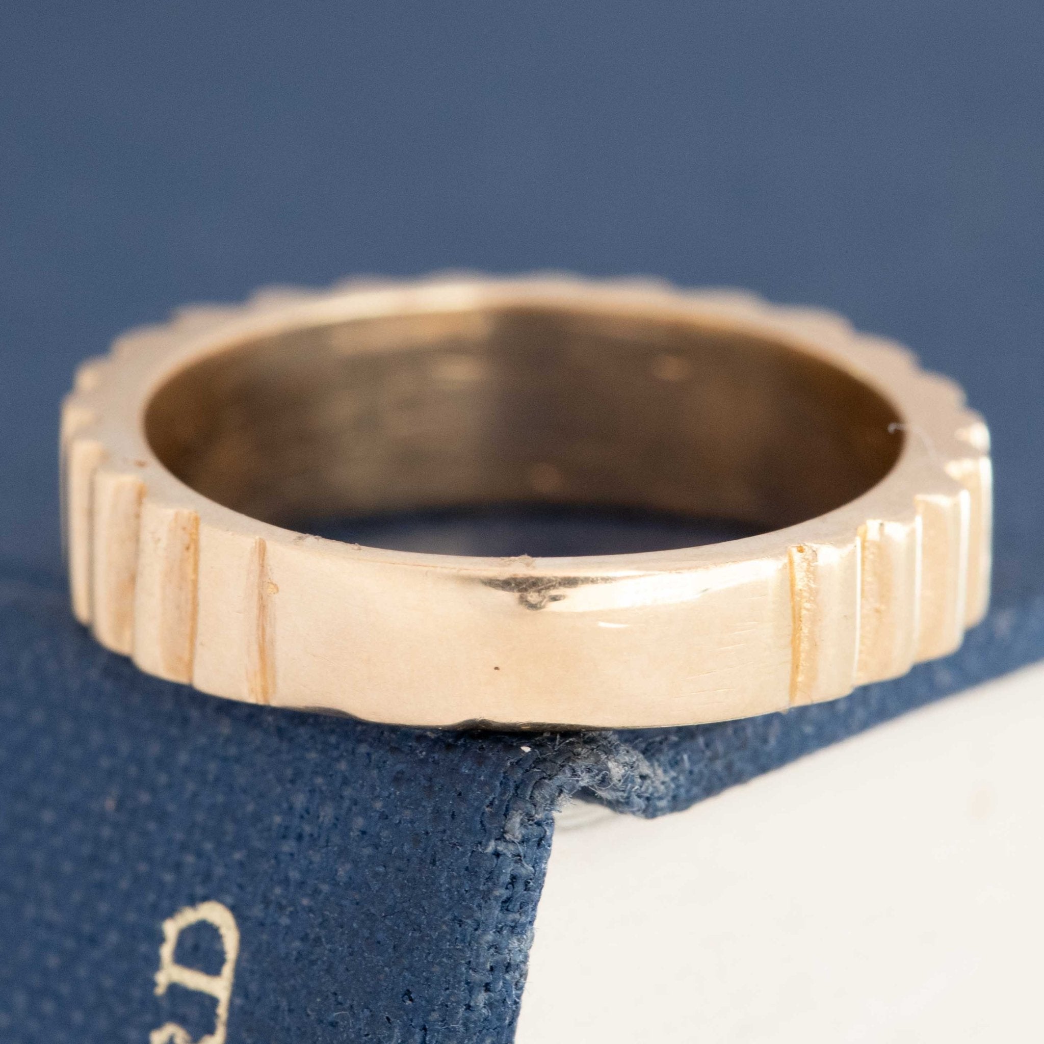 Close-up of vintage fluted band ring detail