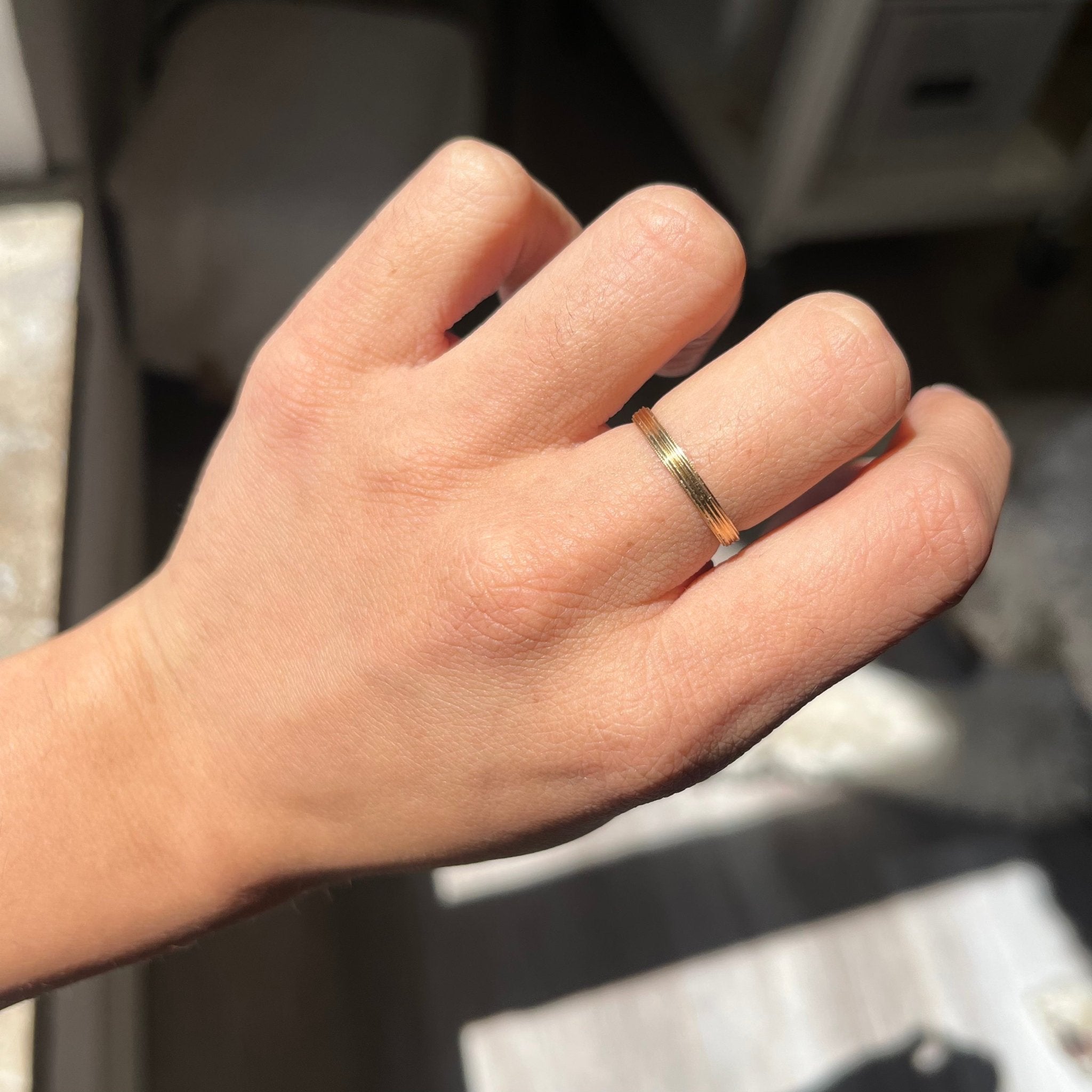 vintage gold band on finger
