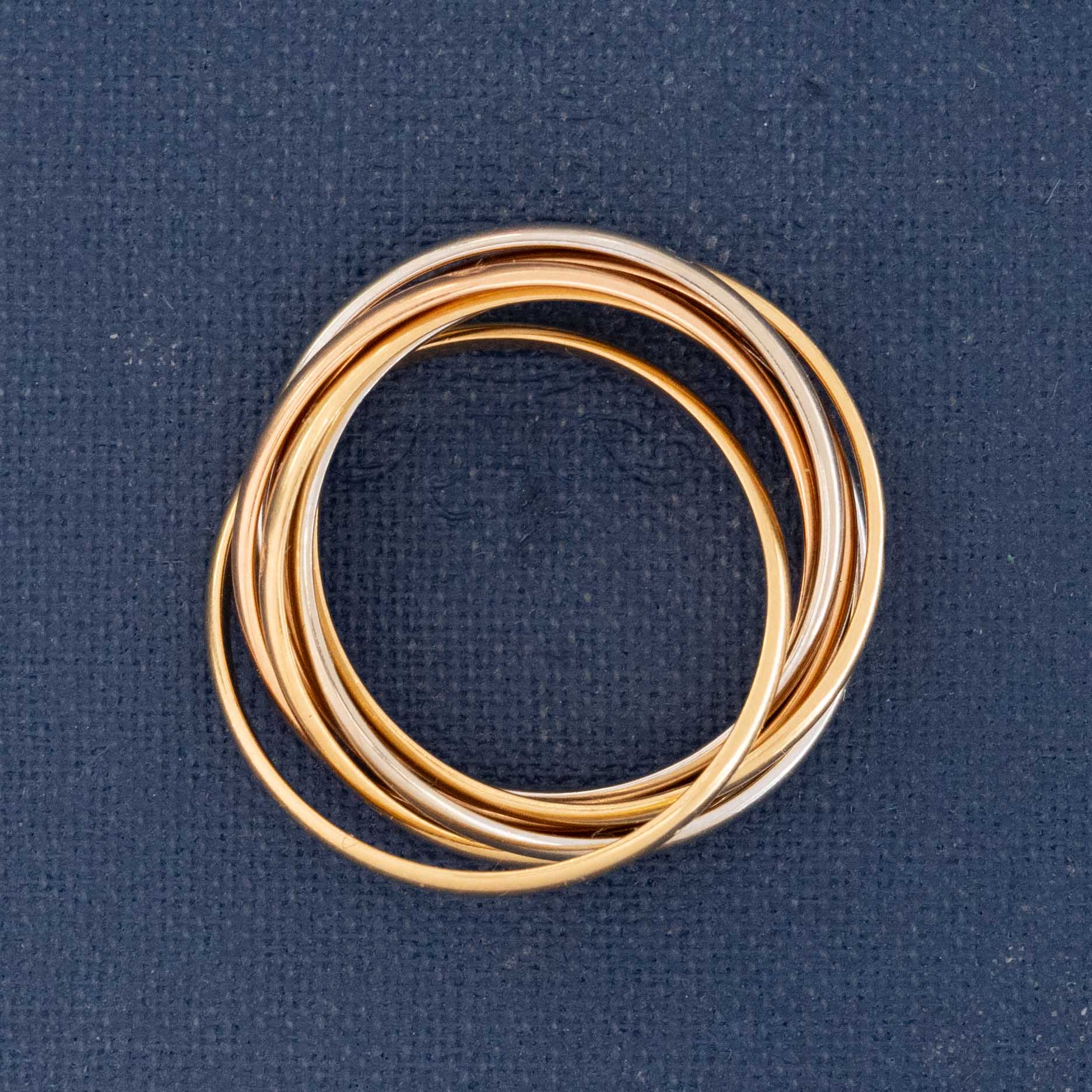 Vintage Cartier Seven Rolling Ring, seven interlocked bands in mixed gold