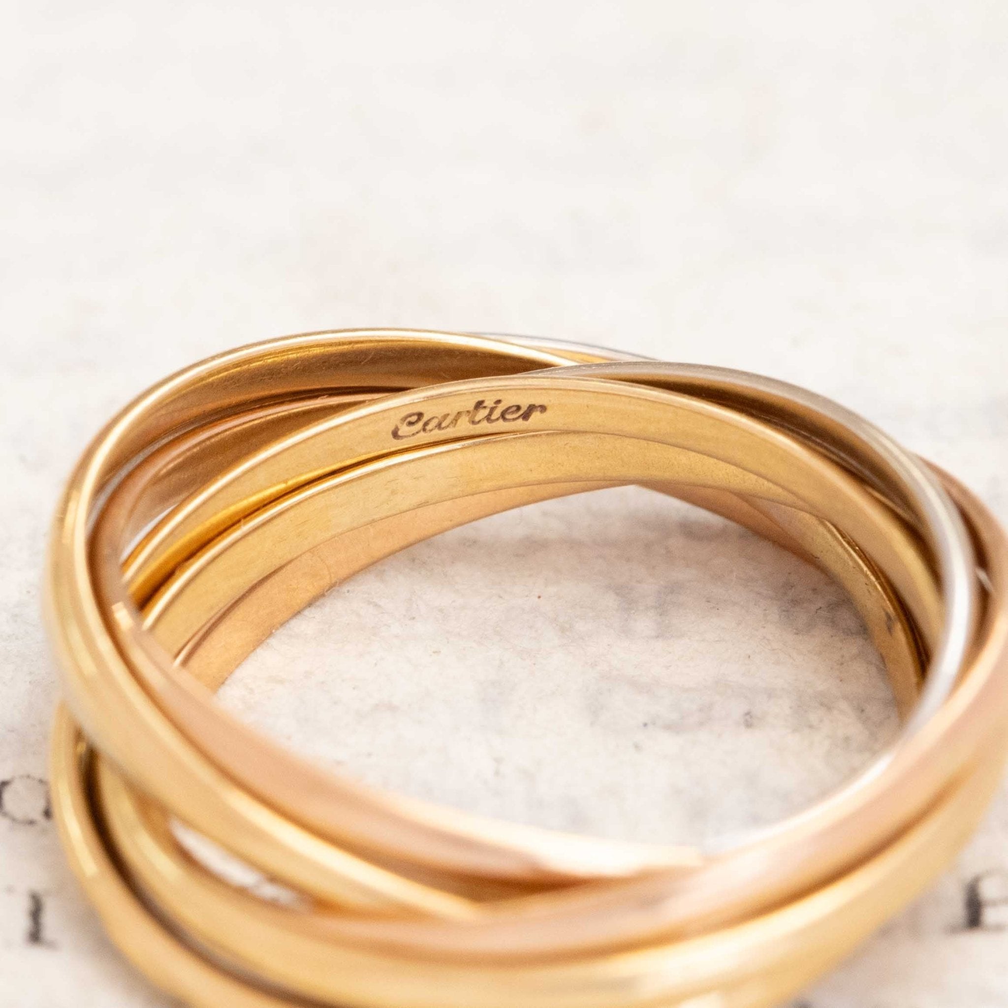 Cartier France Seven Rolling Ring close-up of mixed gold bands