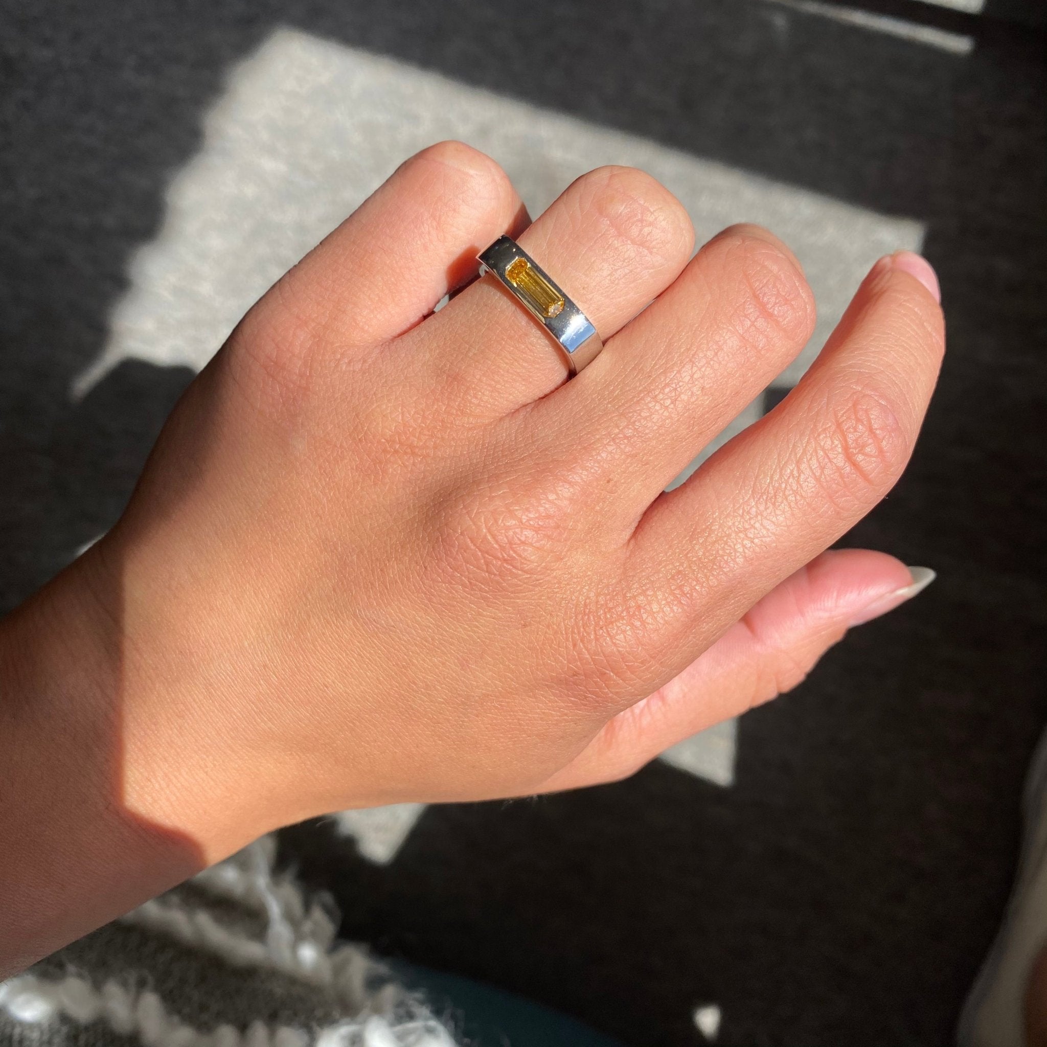 Elegant .70ct Emerald Cut Diamond Square Shank Band, GIA, romantic design with Baguette Cut Diamonds, Earth-mined diamonds in platinum shown on ring finger