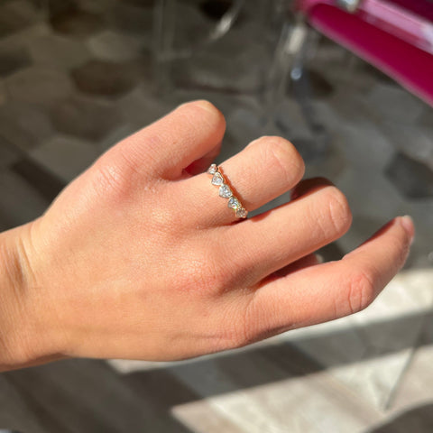 Elegant .92ctw Heart Cut Diamond 5-Stone Bezel Band, romantic design with Antique Diamonds, Earth-mined diamonds in rose gold shown on ring finger