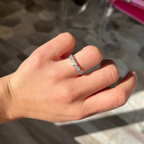 Elegant .93ctw Heart Cut Diamond 5-Stone Bezel Band, romantic design with Antique Diamonds, Earth-mined diamonds in platinum shown on ring finger