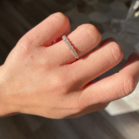 Elegant .93ctw Petite Old Mine Cut Diamond Half-Hoop 9-stone Band, romantic design with Old Mine Cut Diamonds, Earth-mined diamonds in rose gold shown on ring finger