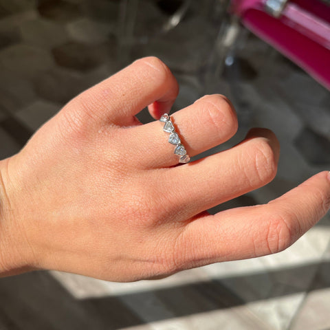 Elegant .96ctw Heart Cut Diamond 5-Stone Bezel Band, romantic design with Antique Diamonds, Earth-mined diamonds in platinum shown on ring finger