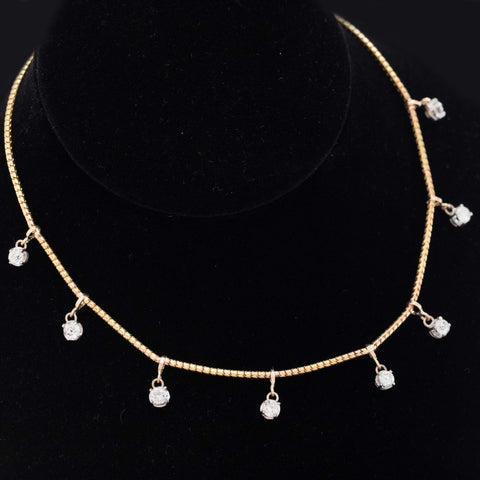 Vintage-inspired 14-inch diamond station necklace in buttery yellow gold with old European cut diamond accents.
