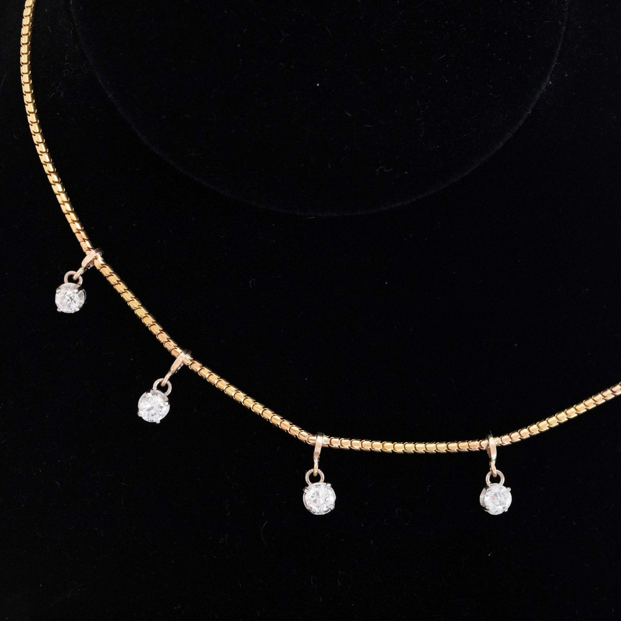Antique yellow gold diamond station necklace with old European cut diamonds, 14-inch choker style.