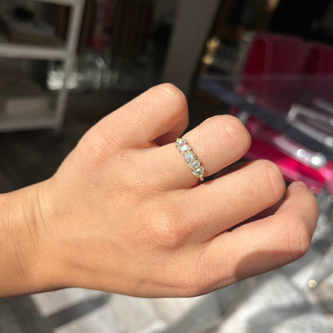 Elegant 1.00ctw Old Mine Cut Diamond 5-Stone Half-Hoop Band, romantic design with Old Mine Cut Diamonds, Earth-mined diamonds in yellow gold shown on ring finger