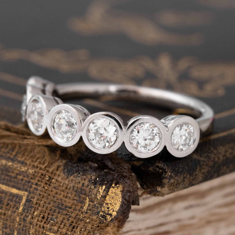 Antique lovers’ 1.01ctw Old European Cut Diamond Bezel Half-Hoop Band in platinum, featuring rare Earth-mined Old European Cut Diamonds from an angled view