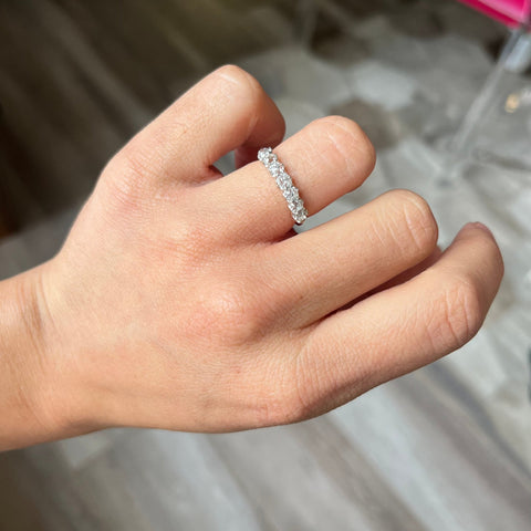 Elegant 1.01ctw Old Mine Cut Diamond 7-Stone Band, romantic design with Old Mine Cut Diamonds, Earth-mined diamonds in platinum and rose gold shown on ring finger