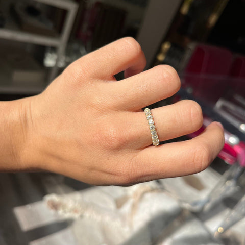 Elegant 1.01ctw Old Mine Cut Diamond Half-Hoop 9-Stone Band, romantic design with Old Mine Cut Diamonds, Earth-mined diamonds in yellow gold shown on ring finger