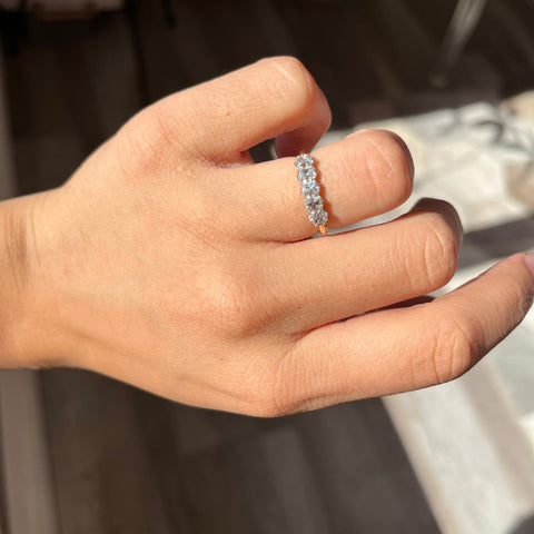 Elegant 1.02ctw Old Mine Cut Diamond 5-Stone Band, romantic design with Old Mine Cut Diamonds, Earth-mined diamonds in platinum and yellow gold shown on ring finger