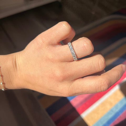 Elegant 1.03ctw Old European Cut Diamond Yin-Yang Half Eternity Band, romantic design with Old European Cut Diamonds, Earth-mined diamonds in platinum and yellow gold shown on ring finger