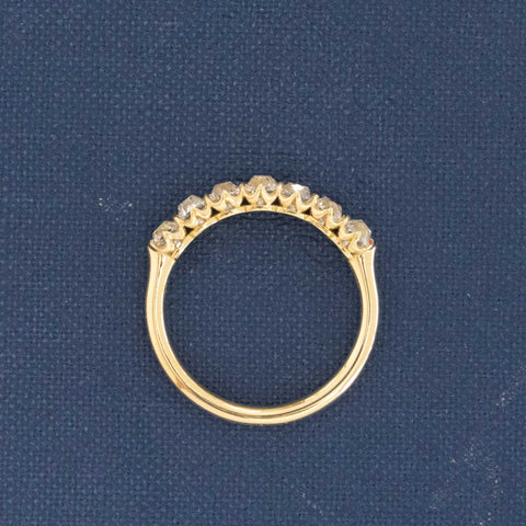 Side view of 1.03ctw Petite Old Mine Cut Diamond 7-Stone Half-Hoop Band, vintage-inspired band with Old Mine Cut Diamonds, crafted in yellow gold