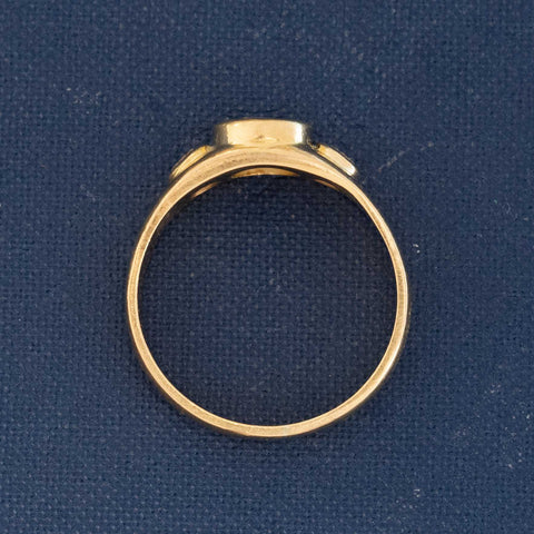 Side profile view of French 3-stone ring