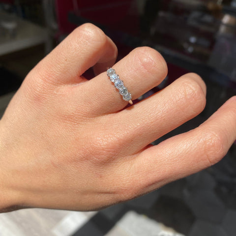 Elegant 1.05ctw Old Mine Cut Diamond 5-Stone Band, romantic design with Old Mine Cut Diamonds, Earth-mined diamonds in platinum shown on ring finger
