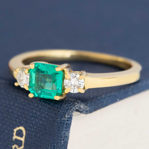 1.05ctw Step Cut Emerald & Diamond Trilogy Ring