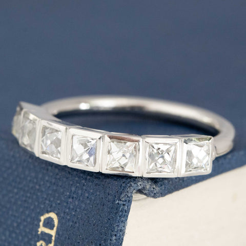 Antique lovers’ 1.06ctw French Cut Diamond 7-Stone Bezel Band in platinum, featuring rare Earth-mined French Cut Diamonds